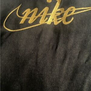 Nike Black Apparel with golden Logo
